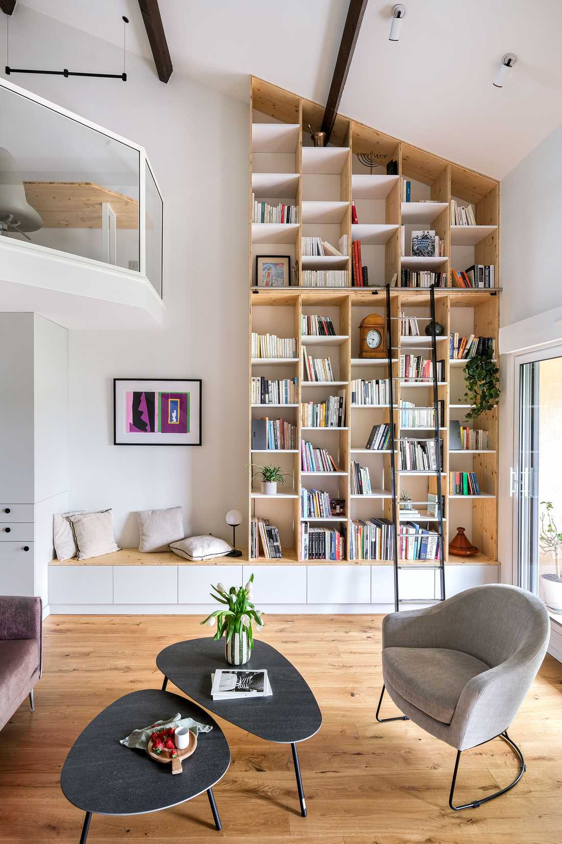 Interior renovation of a house with custom library by an interior designer