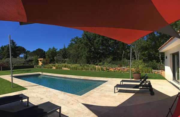 Mediterranean garden around a contemporary swimming pool